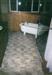 Modern Travertine Floor With Clawfoot Tub
