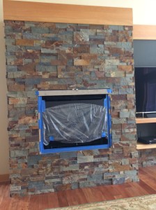 Another stacked stone fireplace